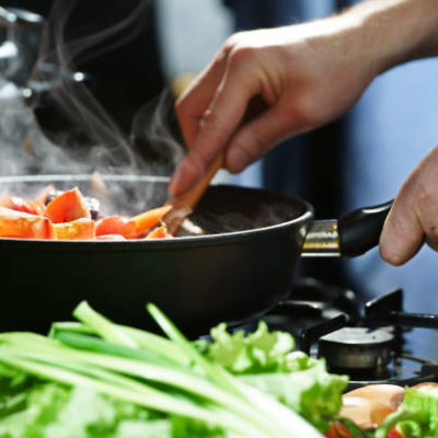 Chef prepares hotpot in the stew pan in the kitchen Chef prepares hotpot in the stew pan in the kitchen